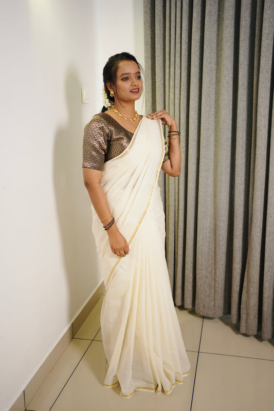 Kerala tradition with this Pure Cotton Golden Border Saree.
