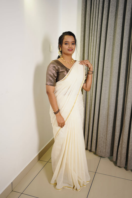 Kerala tradition with this Pure Cotton Golden Border Saree.